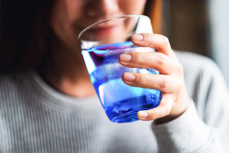 woman morning glass of blue water